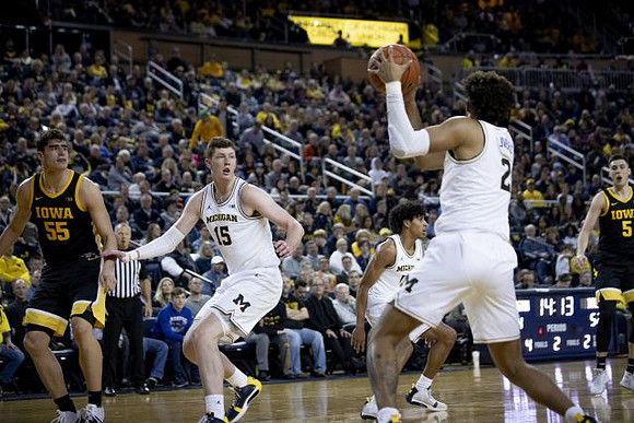 Jon Teske (15), Eli Brooks (55), and Isaiah Livers (2)