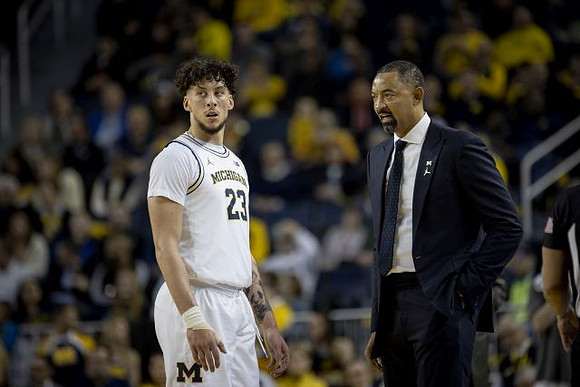 Brandon Johns Jr. (23) and Juwan Howard