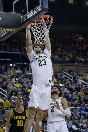 Brandon Johns Jr. (23) and Isaiah Livers (2)