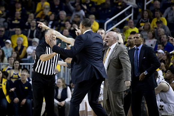 Juwan Howard, Phil Martelli, Saddi Washington, and Howard Eisley