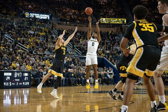 David DeJulius (0) and Jon Teske (15)