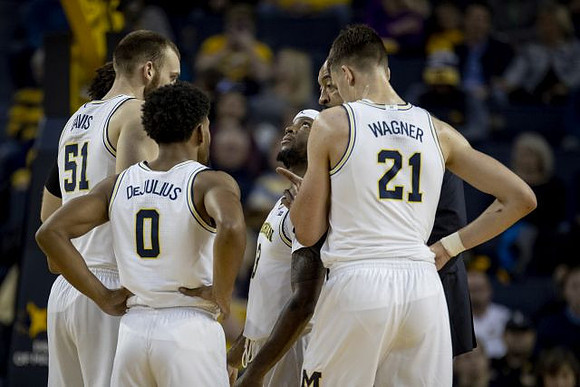 Austin Davis (51), David DeJulius (0), Zavier Simpson (3), and Franz Wagner (21)