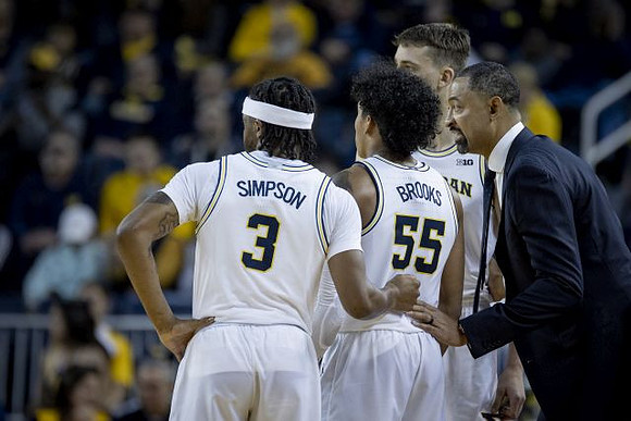 Zavier Simpson (3), Eli Brooks (55), Franz Wagner (21), and Juwan Howard