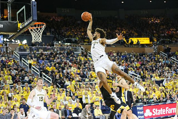 Jon Teske (15) and Isaiah Livers (2)
