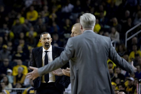 Juwan Howard and Iowa Head Coach Fran McCaffery