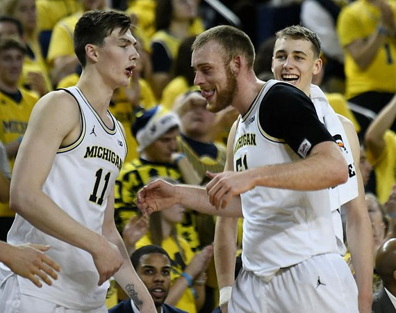 Colin Castleton (11), Austin Davis (51), and Franz Wagner (21)