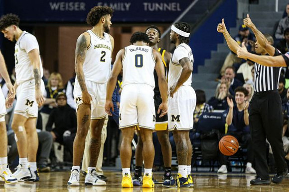 Brandon Johns Jr. (23), Isaiah Livers (2), David DeJulius (0), and Zavier Simpson (3)