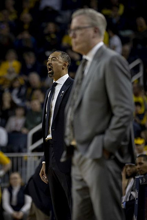 Juwan Howard and Iowa Head Coach Fran McCaffery