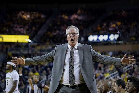 Iowa Head Coach Fran McCaffery and Zavier Simpson (3)