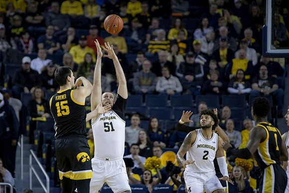 Austin Davis (51) and Isaiah Livers (2)