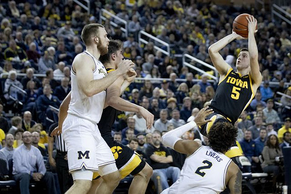 Austin Davis (51) and Isaiah Livers (2)
