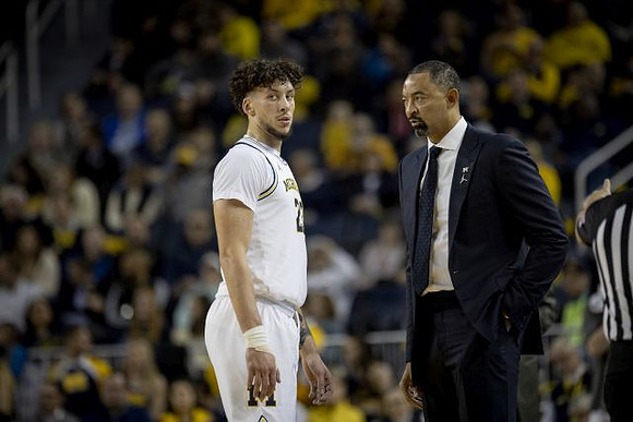 Brandon Johns Jr. (23) and Juwan Howard