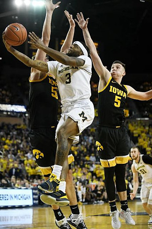 Zavier Simpson (3) and Austin Davis (51)