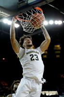 Brandon Johns Jr. (23) and Isaiah Livers (2)
