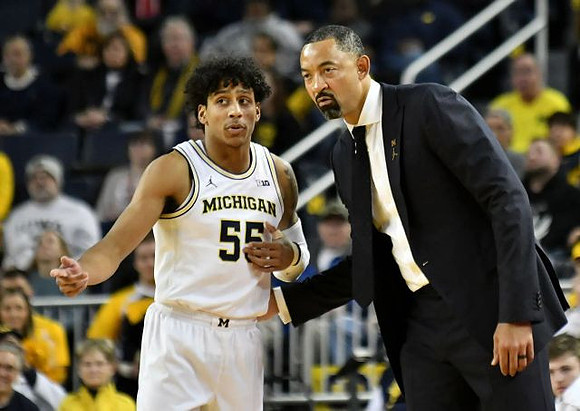 Eli Brooks (55) and Juwan Howard