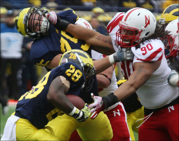 Fitzgerald Toussaint (28) and Michael Schofield (75)