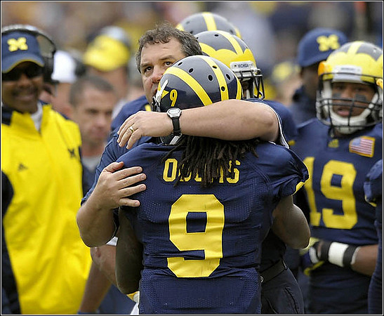 Fred Jackson, Brady Hoke, Martavious Odoms (9), and Kelvin Grady (19)