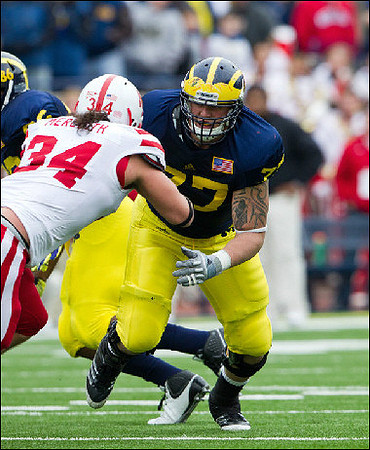Kevin Koger (86) and Taylor Lewan (77)