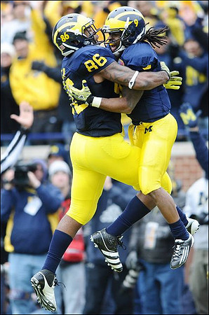 Kevin Koger (86) and Martavious Odoms (9)