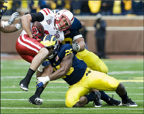 Kenny Demens (25) and Mike Martin (68)