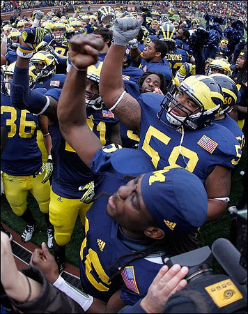 Denard Robinson (16) and Brandon Herron (58)