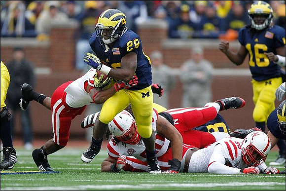 Fitzgerald Toussaint (28) and Denard Robinson (16)