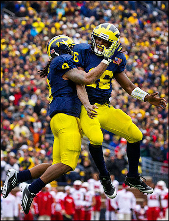 Martavious Odoms (9) and Denard Robinson (16)