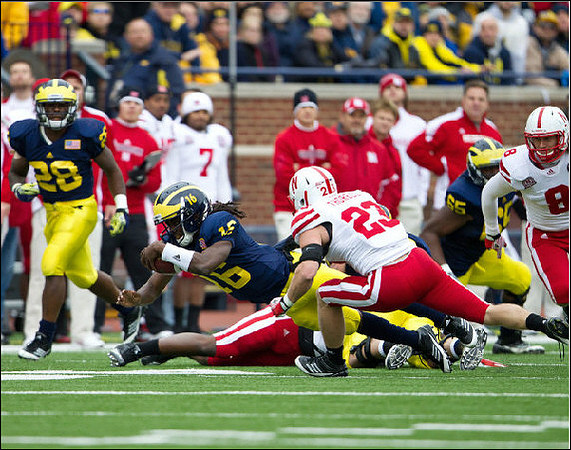 Fitzgerald Toussaint (28), Denard Robinson (16), and Patrick Omameh (65)