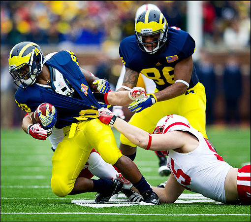 Fitzgerald Toussaint (28) and Kevin Koger (86)