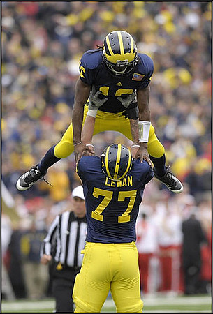 Denard Robinson (16) and Taylor Lewan (77)