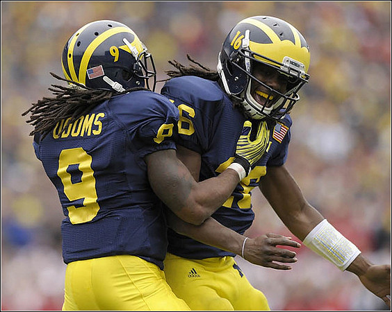 Martavious Odoms (9) and Denard Robinson (16)