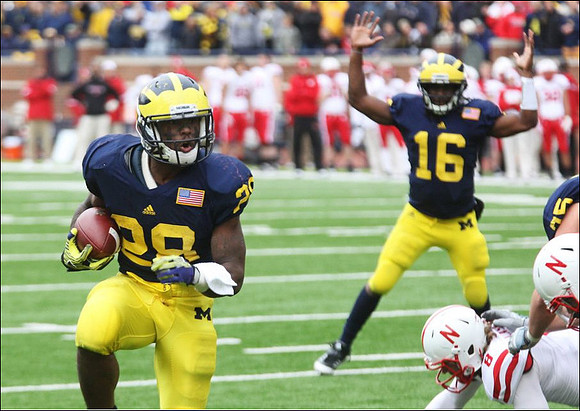 Fitzgerald Toussaint (28) and Denard Robinson (16)