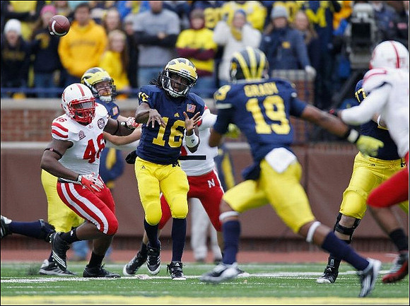 Denard Robinson (16) and Kelvin Grady (19)