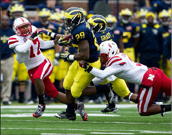 Fitzgerald Toussaint (28) and Kelvin Grady (19)