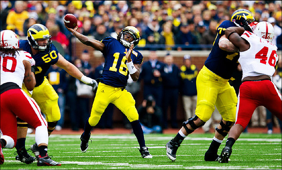 David Molk (50), Denard Robinson (16), and Taylor Lewan (77)