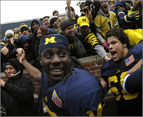 Denard Robinson (16) and Mike Martin (68)