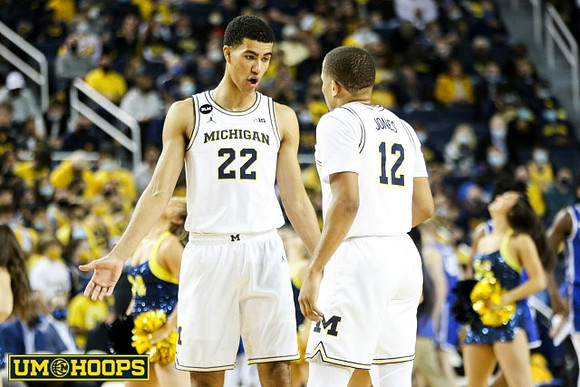 Caleb Houstan (22) and DeVante' Jones (12)