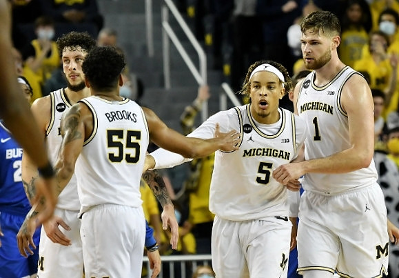 Brandon Johns Jr. (23), Eli Brooks (55), Terrance Williams II (5), and Hunter Dickinson (1)