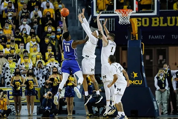 Terrance Williams II (5), Hunter Dickinson (1), and DeVante' Jones (12)