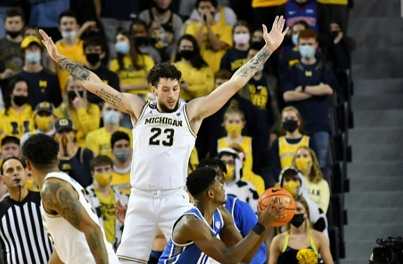 Eli Brooks (55) and Brandon Johns Jr. (23)