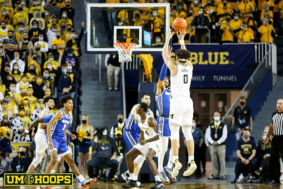 Brandon Johns Jr. (23) and Adrien Nunez (0)
