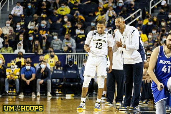 DeVante' Jones (12) and Juwan Howard