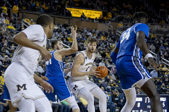 DeVante' Jones (12) and Hunter Dickinson (1)