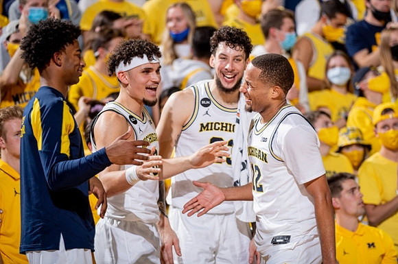 Jace Howard (25), Adrien Nunez (0), Brandon Johns Jr. (23), and DeVante' Jones (12)