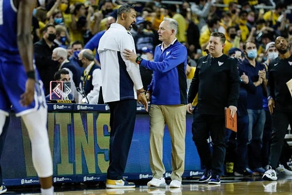 Juwan Howard and Buffalo Head Coach Jim Whitesell