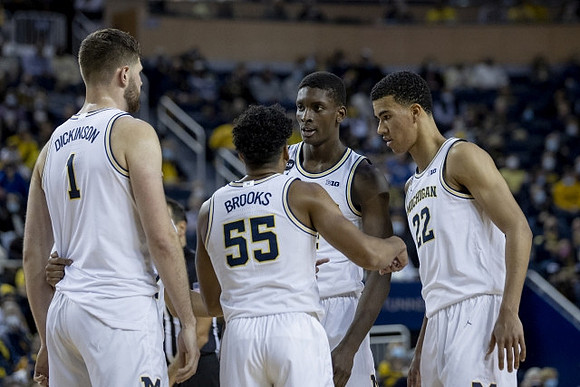 Hunter Dickinson (1), Eli Brooks (55), Moussa Diabate (14), and Caleb Houstan (22)