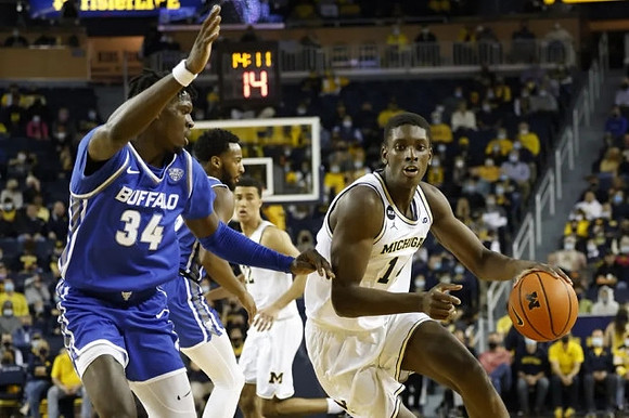 Caleb Houstan (22) and Moussa Diabate (14)