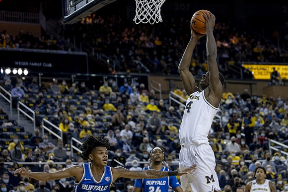 Moussa Diabate (14) and Eli Brooks (55)