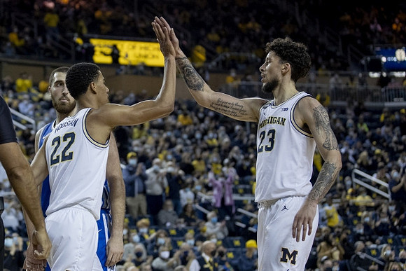 Caleb Houstan (22) and Brandon Johns Jr. (23)