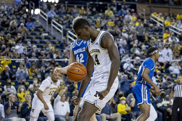 Moussa Diabate (14) and DeVante' Jones (12)